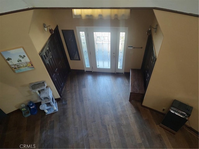 foyer entrance featuring dark wood-style flooring