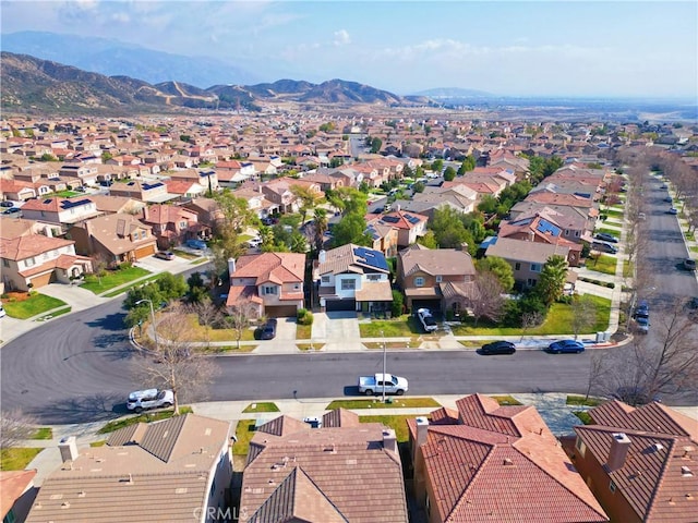 birds eye view of property with a mountain view