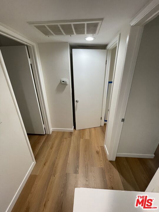 corridor featuring light hardwood / wood-style flooring