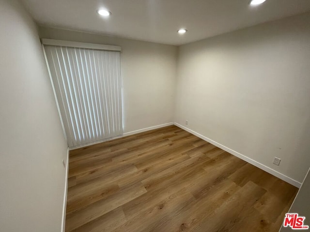 empty room featuring hardwood / wood-style flooring