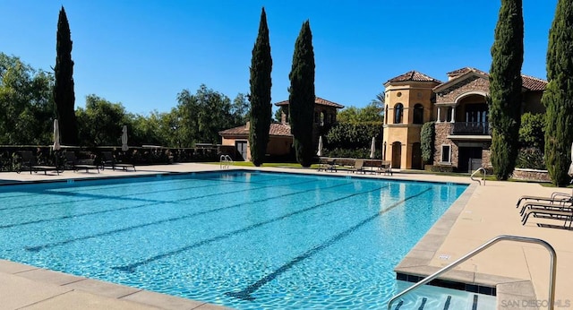 view of swimming pool with a patio area