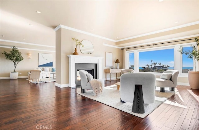 living room featuring ornamental molding and dark hardwood / wood-style floors