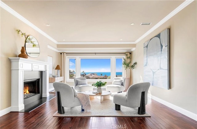 living room with dark hardwood / wood-style flooring and ornamental molding