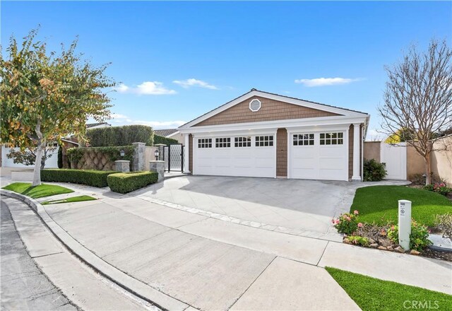 view of front of home featuring a garage and an outdoor structure