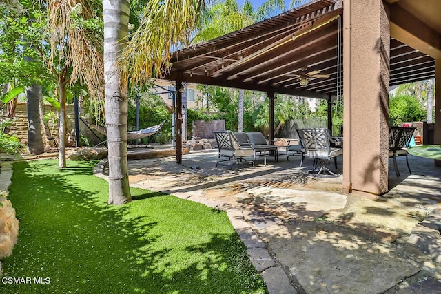 view of patio / terrace featuring ceiling fan