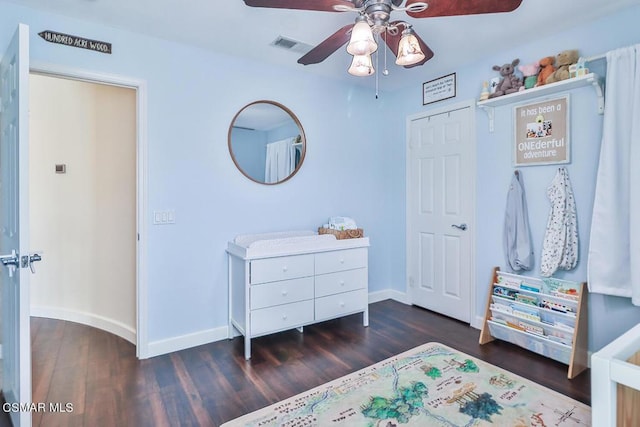 bedroom featuring dark hardwood / wood-style flooring and ceiling fan