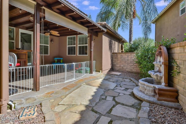 view of patio with ceiling fan