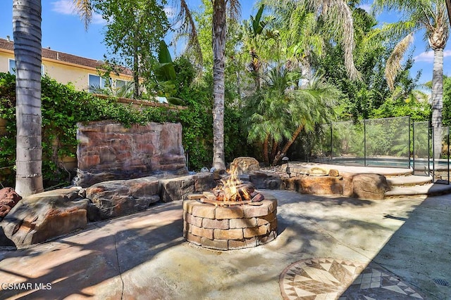 view of patio / terrace featuring a fire pit