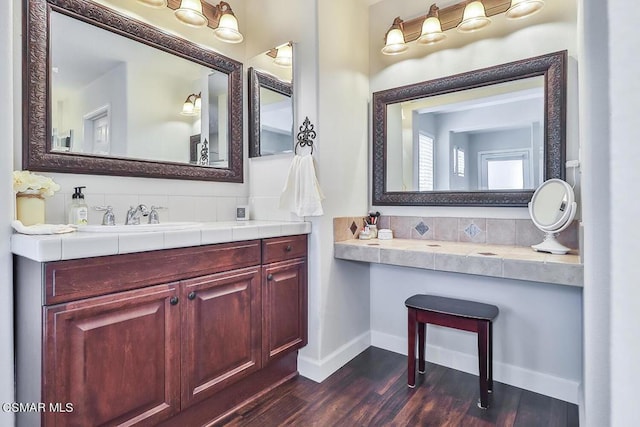 bathroom with vanity and hardwood / wood-style flooring