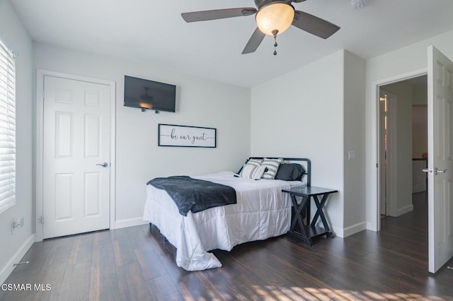 bedroom featuring dark wood-type flooring and ceiling fan