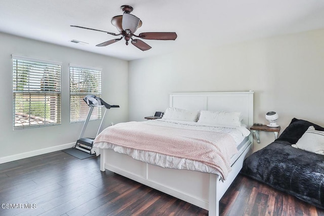 bedroom with dark wood-type flooring and ceiling fan