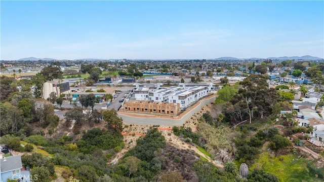 birds eye view of property featuring a mountain view