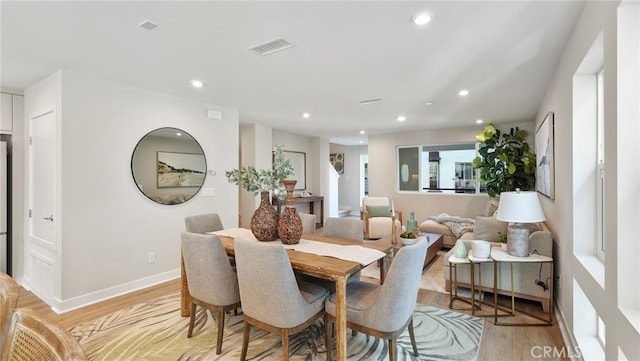 dining area with light hardwood / wood-style floors