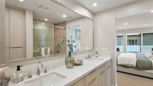 bathroom with vanity and walk in shower