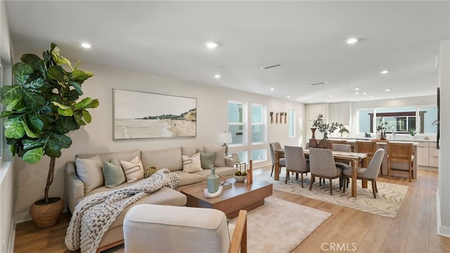 living room with light hardwood / wood-style floors