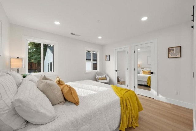 bedroom with light wood-type flooring