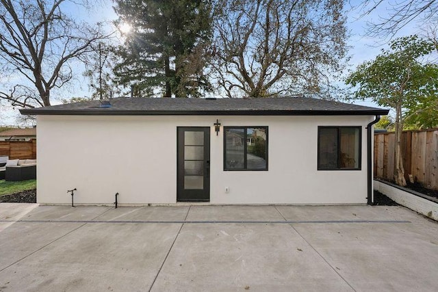 rear view of property featuring a patio