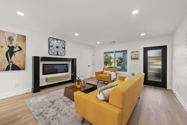 living room with light hardwood / wood-style floors