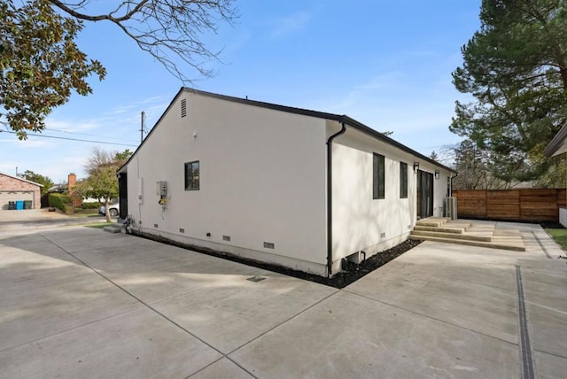 view of property exterior featuring a patio area