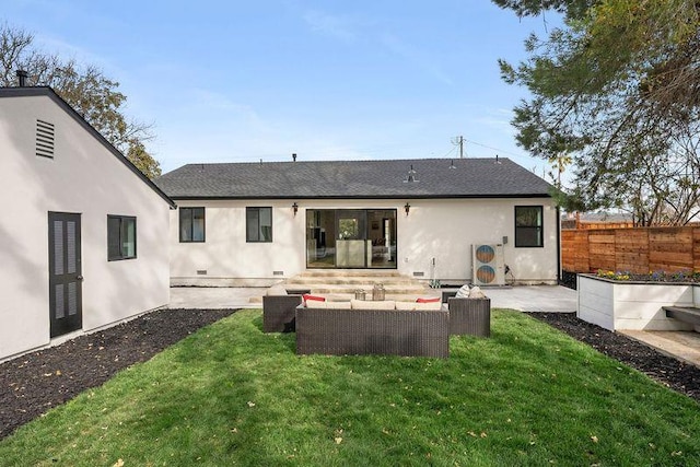 back of house with an outdoor living space, a patio area, and a lawn