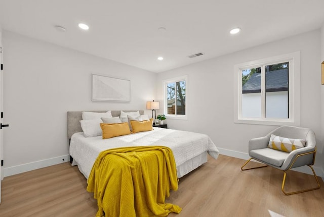 bedroom with light hardwood / wood-style flooring