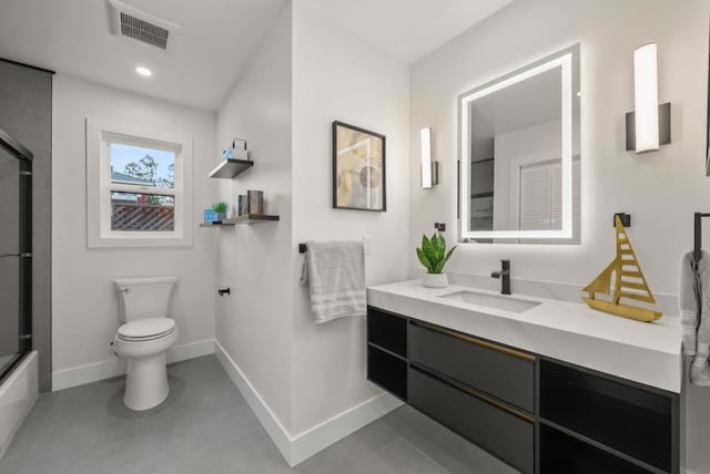 full bathroom featuring vanity, shower / bath combination with glass door, and toilet