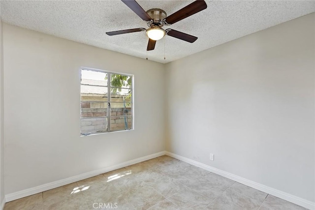 unfurnished room featuring ceiling fan and a textured ceiling