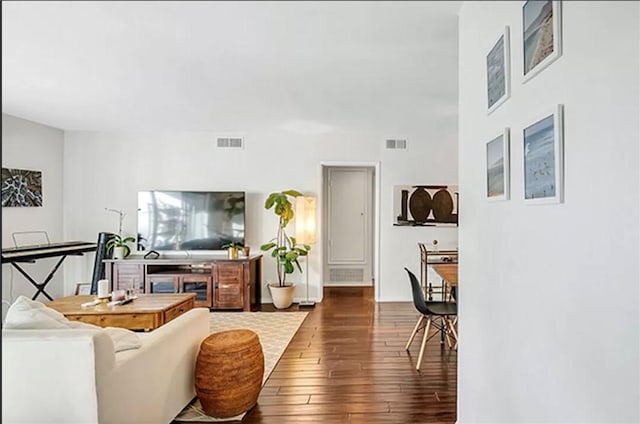 living room featuring dark hardwood / wood-style floors