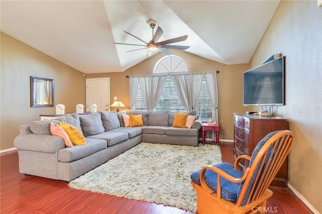 living room featuring vaulted ceiling, dark hardwood / wood-style floors, and ceiling fan