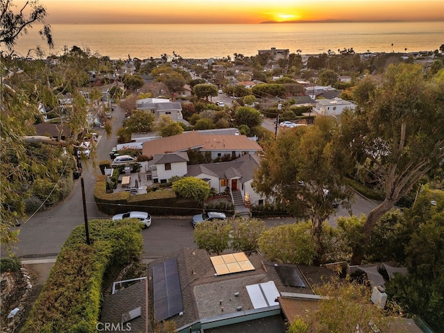 aerial view at dusk with a water view