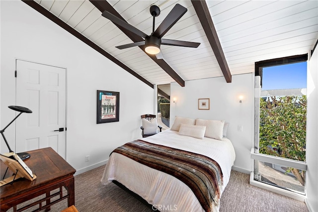 carpeted bedroom with lofted ceiling with beams and ceiling fan