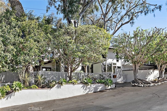 view of property hidden behind natural elements