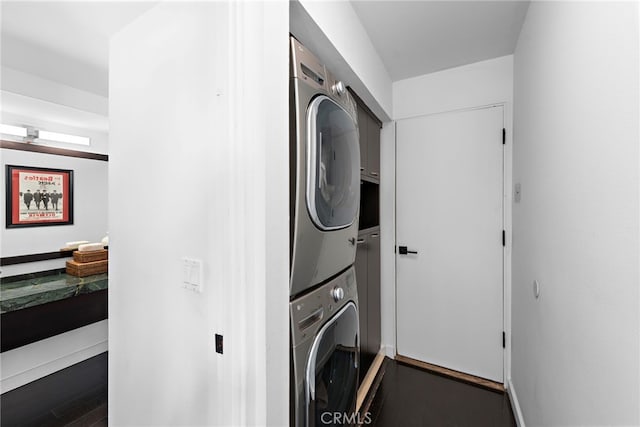 laundry area featuring stacked washer and clothes dryer