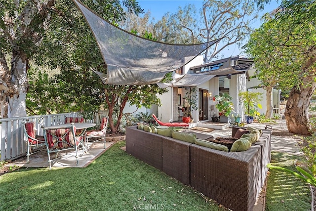 view of yard with an outdoor living space and a patio