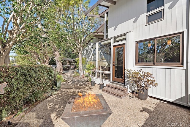 view of patio with a fire pit