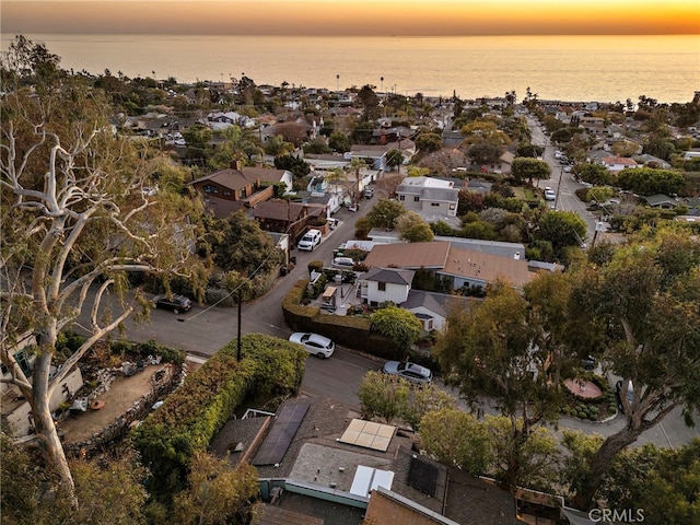 aerial view at dusk with a water view