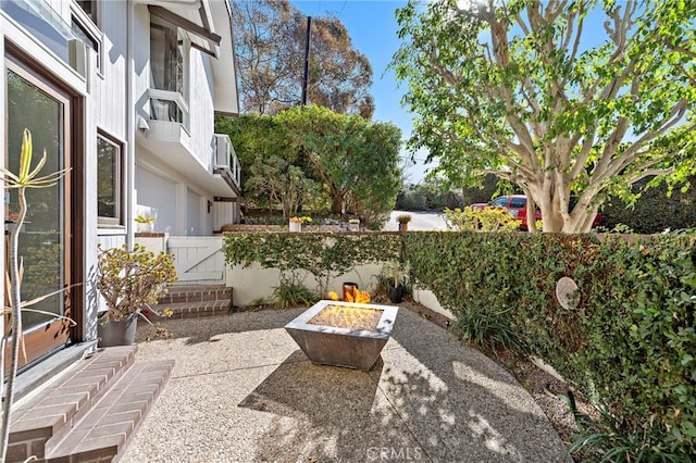 view of patio / terrace with a fire pit