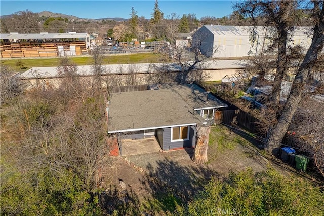 birds eye view of property featuring a mountain view