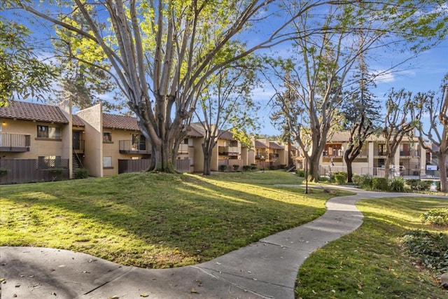 surrounding community featuring a lawn