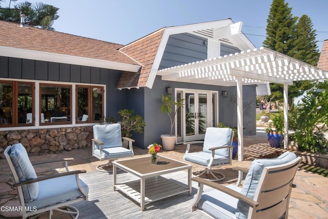 view of patio featuring a pergola and french doors