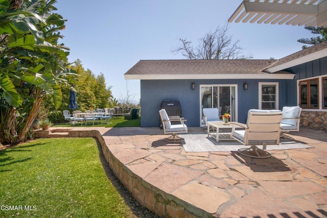 view of patio / terrace with grilling area and a pergola