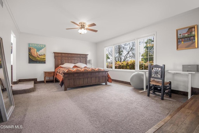 carpeted bedroom featuring ornamental molding and ceiling fan