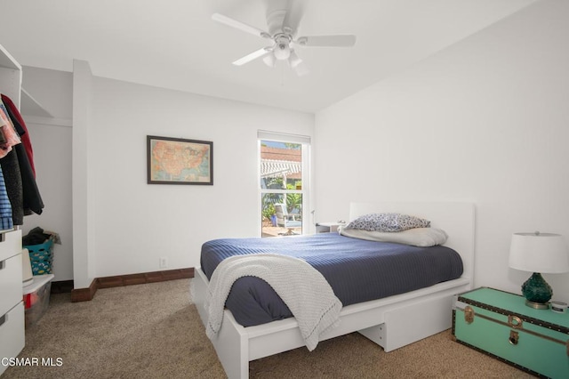 bedroom featuring ceiling fan and carpet