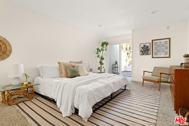 carpeted bedroom featuring access to exterior