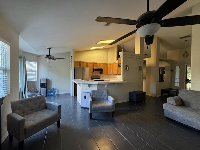 living room with ceiling fan and lofted ceiling