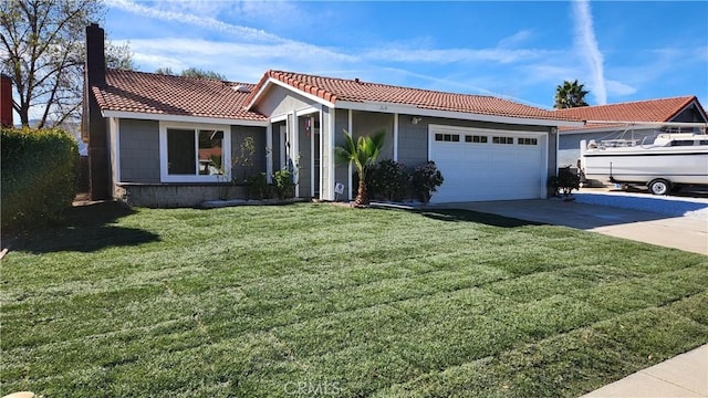 view of front of home featuring a garage and a front yard