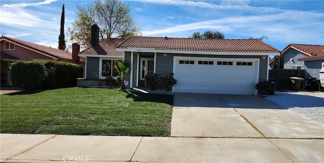 view of front of house with a garage and a front lawn