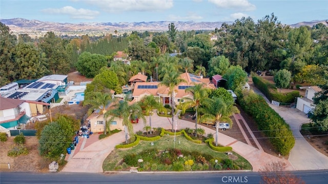 birds eye view of property with a mountain view