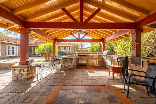 view of patio with area for grilling, a gazebo, and grilling area