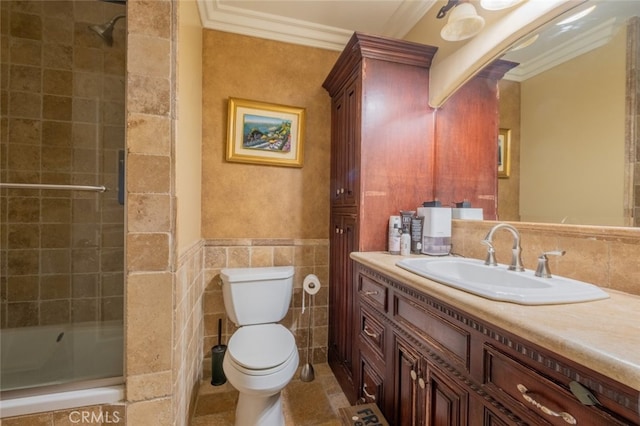 bathroom with ornamental molding, toilet, tile walls, and vanity